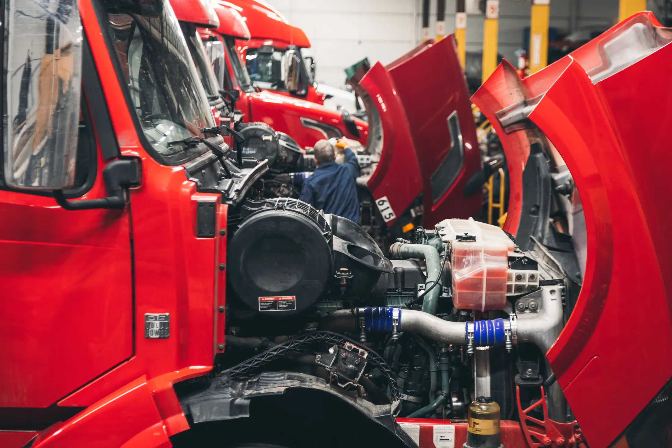 A vehicle up on the lift in the Top Auto & Truck Repair service bay